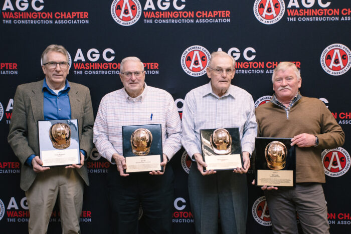 Photos of the four 2024 Distinguished Service Award winners, each holding a plaque in front of an  AGC logo backdrop.